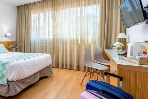 En eller flere senger på et rom på Daniya Alicante