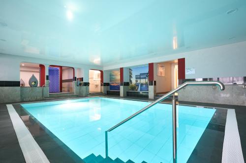 a large swimming pool in a house at Hotel Ritter Badenweiler in Badenweiler