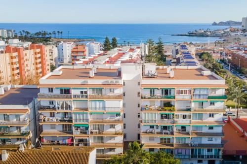an aerial view of apartment buildings and the ocean at Appartement Arenal in Jávea