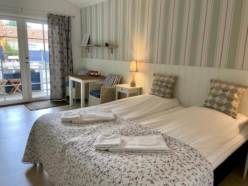 En eller flere senge i et værelse på Hotel Villa Brinkly