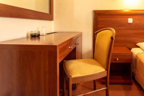 Una cama o camas en una habitación de Telis Hotel