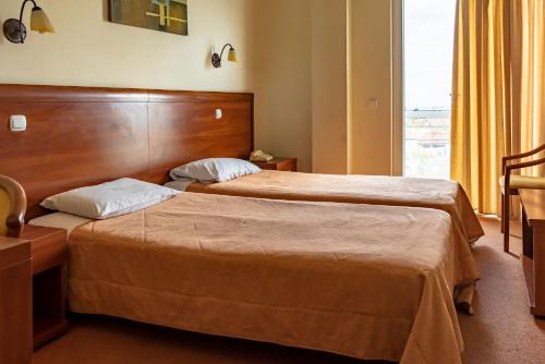 Una cama o camas en una habitación de Telis Hotel