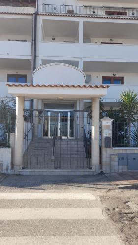 a building with a gate in front of it at Appartamenti Bramante in Vieste