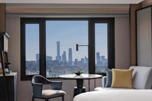 Postel nebo postele na pokoji v ubytování Prime Hotel Beijing Wangfujing