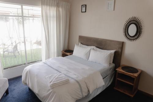 Postel nebo postele na pokoji v ubytování Happy Living Guesthouse