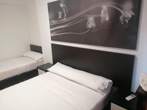 A bed or beds in a room at Hello Madrid