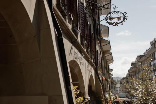 a street in a city with christmas trees and a building at Goldener Schlüssel in Bern