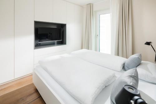 Postel nebo postele na pokoji v ubytování meer suite juist 6 - mit Wattblick