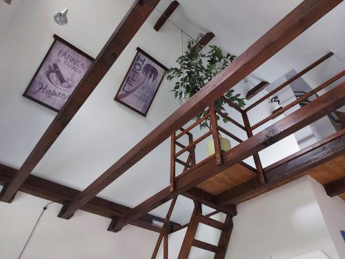 a staircase in a room with wooden beams at Ferienwohnung Strandnah in Cuxhaven