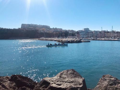 a group of people in a boat in the water at Il Riccio Apartment 28 in Procida
