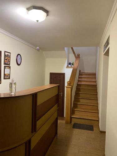 a stairway leading up to a room with a stair case at Відпочинковий комплекс,міні готель Старий дворик in Lviv