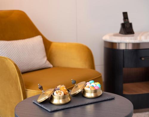 a tray with three bowls of food on a table at Address Istanbul in Istanbul