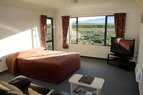 Postel nebo postele na pokoji v ubytování Avalon Manor Motel