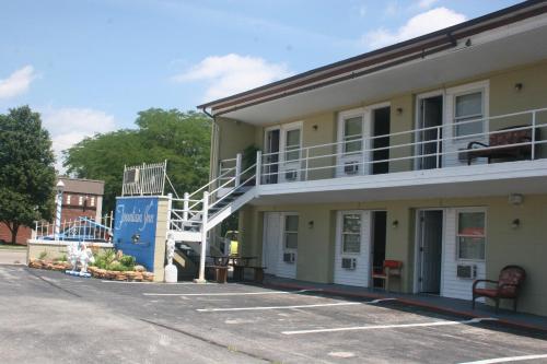 a building with a staircase on the side of it at Fountain Inn in Van Wert