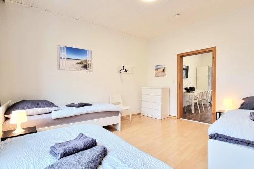 a bedroom with two beds and a dining room at 3 room apartment in Hagen Eilpe in Hagen