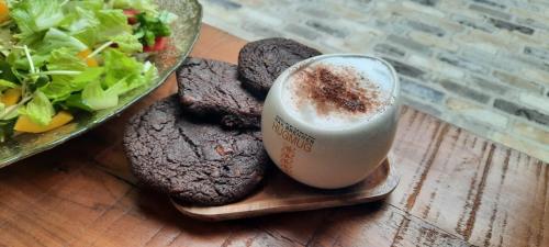 a plate of cookies and a drink and a salad at The house of love in Meitar