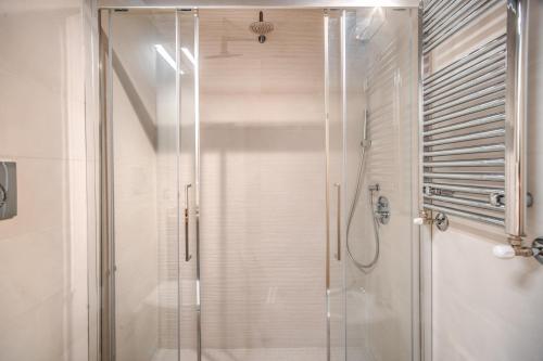 a shower with a glass door in a bathroom at Casa Vantaggio in Rome
