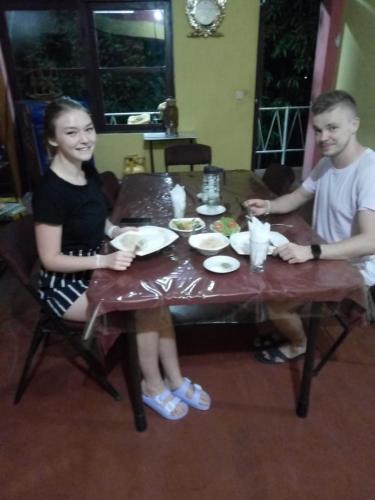 a man and a woman sitting at a table at Dealings Freedom Rest in Gampola