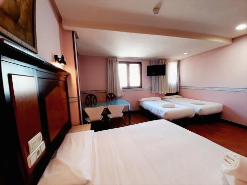 Postel nebo postele na pokoji v ubytování Hosteria Sara by gaiarooms