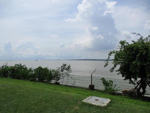a view of a large body of water at Ganga Kutir Oak Villa on Raichak in Raichak