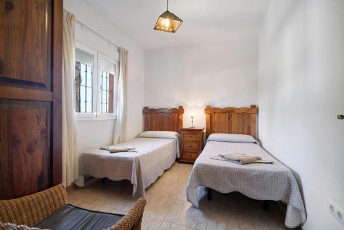 Postel nebo postele na pokoji v ubytování Villa Fátima