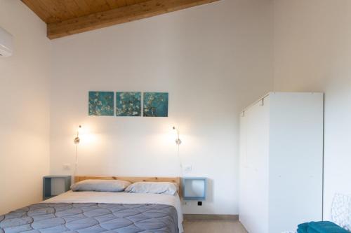Ένα ή περισσότερα κρεβάτια σε δωμάτιο στο DOMEK Villa a 100mt dalla spiaggia