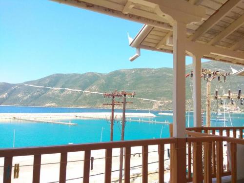 a view of the water from a balcony of a beach at Kostas Studios in Vasiliki