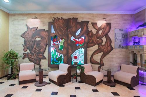 a waiting room with a painting on the wall at Art Hotel Babylon in Sunny Beach