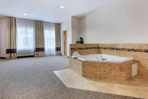 a large bathroom with a large tub in a room at Comfort Inn Apalachin - Binghamton W Route 17 in Apalachin
