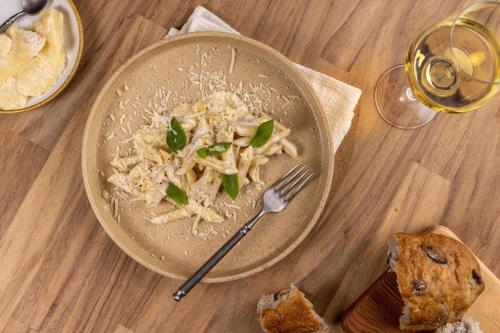 a plate of pasta with a fork on a table at Moon Palace Jamaica - All Inclusive in Ocho Rios