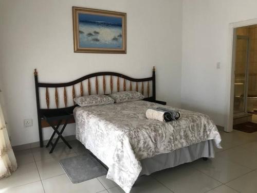 a bedroom with a bed with a camera on it at Luxury3 bedroom 6 sleeper penthouse apartment in Shellybeach in Margate