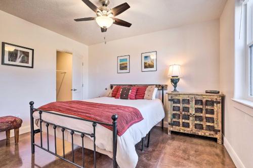 a bedroom with a bed and a ceiling fan at Quaint Kanab Casita - 3 Mi to the Heart of Town! in Kanab
