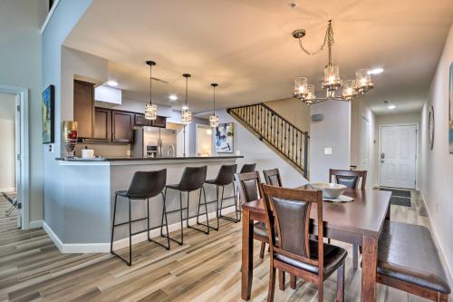 a dining room and kitchen with a table and chairs at Private Boat Slip Lake-View Osage Beach Getaway! in Osage Beach