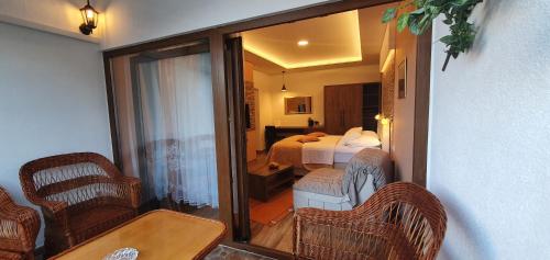a room with a view of a bedroom with a bed at Villa Cardak in Mostar