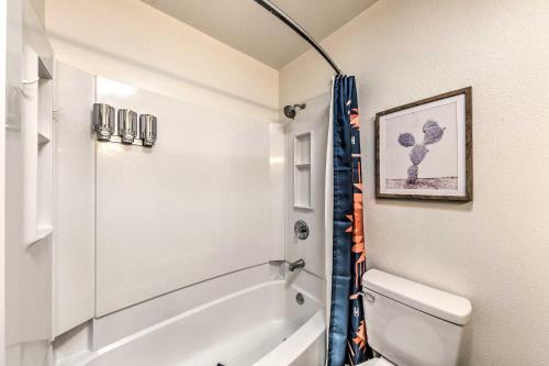a bathroom with a shower and a toilet at Ruidoso House with Beautiful Indoor and Outdoor Space! in Ruidoso