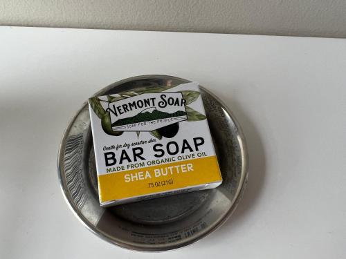 a bar soap sitting on a silver plate at Shoreham Inn Bed & Breakfast in Shoreham