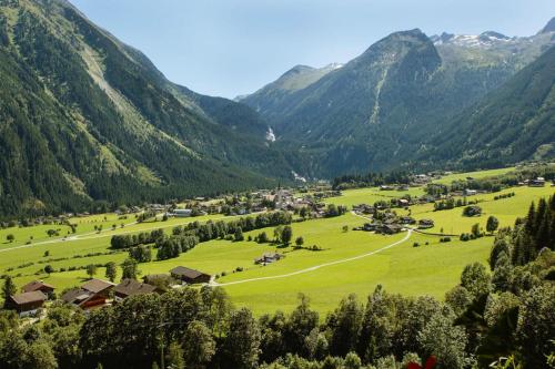 a village in a valley with mountains in the background at Chalet in Krimml near Europe's Highest Waterfall in Krimml