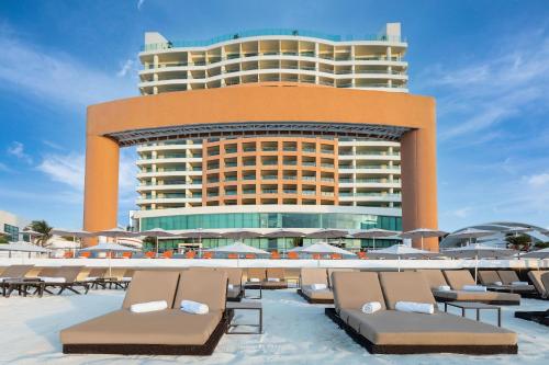 a large building with a lot of tables and chairs at Beach Palace - All Inclusive in Cancún