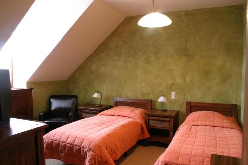 Ένα ή περισσότερα κρεβάτια σε δωμάτιο στο Sarlóspuszta Club Hotel