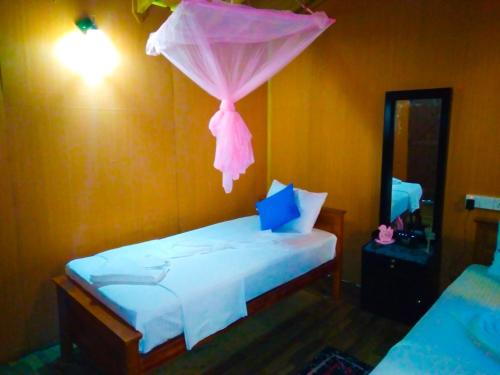Cama o camas de una habitación en Akash Treehouse