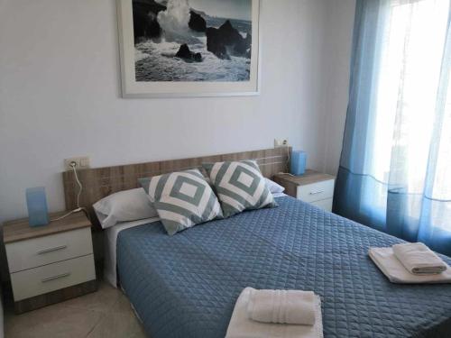 Llit o llits en una habitació de A H RENTALS Montemar 4 apartamento