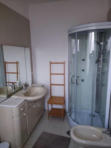 a bathroom with a shower and a sink and a toilet at Casa Castellano in Nola