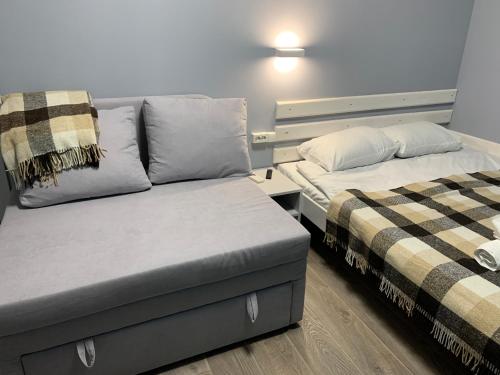two beds sitting next to each other in a room at Lito in Zatoka