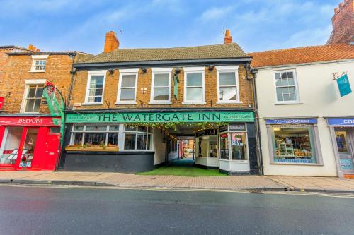 a group of buildings on a city street at The Watergate Inn in York