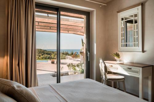 Ένα ή περισσότερα κρεβάτια σε δωμάτιο στο Zeus Exclusive Villas