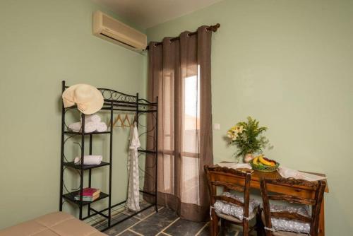 a room with a bed and a window with a curtain at Villa Georgia in Kalyves