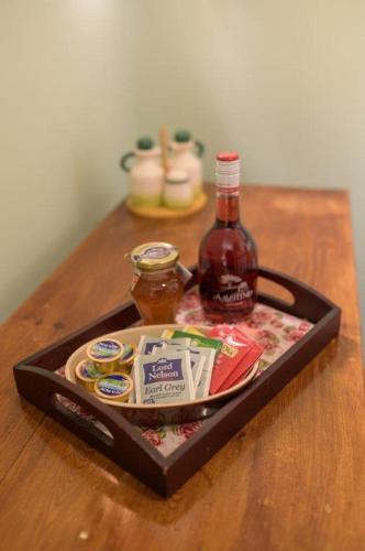 a tray of food and a bottle of alcohol on a table at Villa Georgia in Kalyves