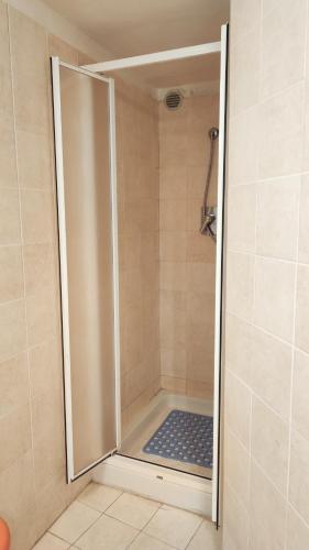 a shower with a glass door in a bathroom at Casa Lucilla in Pizzo