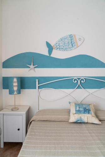 Katil atau katil-katil dalam bilik di Nora Guesthouse Rooms and Villas