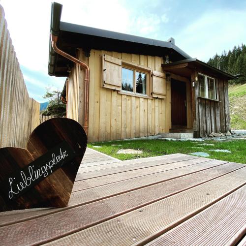 a wooden deck in front of a house at Nüggili's Maisäß in Tschagguns